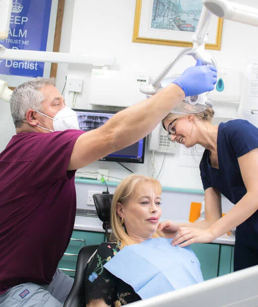 Dental team providing expert care to a patient