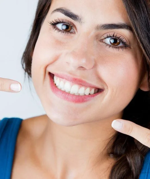 Woman with a bright, confident smile after cosmetic dentistry